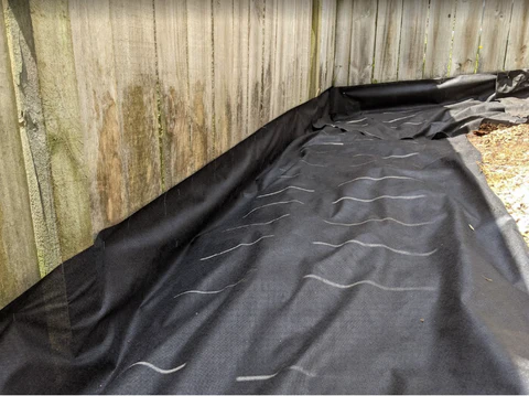 photo if weed mat fence